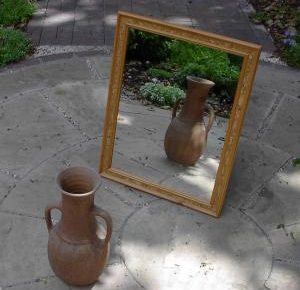 Jar in front of a mirror