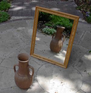 Jar in front of a mirror